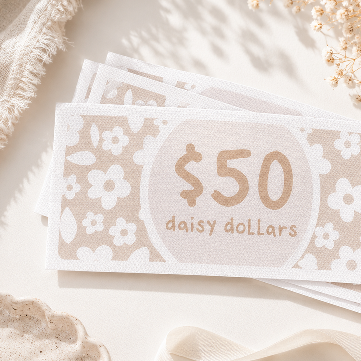 A stack of decorative $50 gift cards labeled &