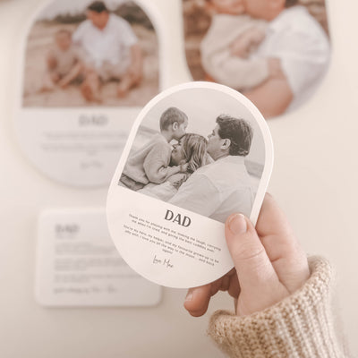 Heart-shaped photo coasters with printed images and text on a light background